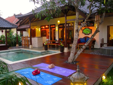 Veranda with pool, outdoor kitchen and dining area, gazebo and outdoor bathtub