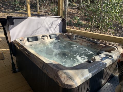 Perdonal hot tub on covered porch.  Great in all weather conditions.