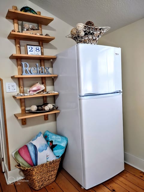 Full-size fridge allows for ready-to-eat food on hand & supplies for cooking