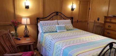 Cozy upper room with queen size bed and spa bath