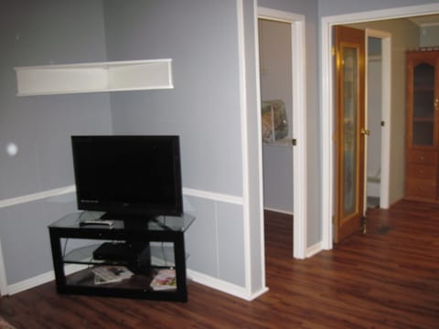Master bedroom. TV and large walk in closet. Just ahead is master bathroom
