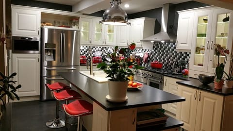 Newly refurbished kitchen with stainless steel appliances and granite countertop