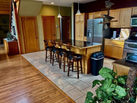 Open plan kitchen with large island for preparing meals 