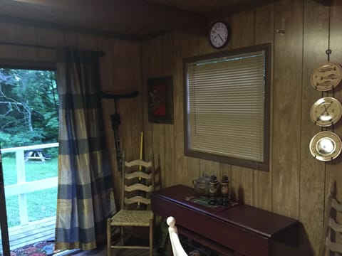 Dining table pulls out to seat 4. Walking sticks and Picnic supplies are here