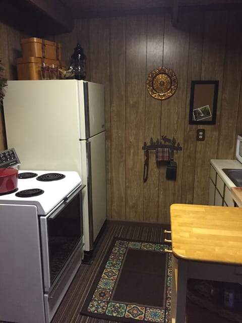 Full size kitchen including coffee maker and microwave plus pots, pans, dishes