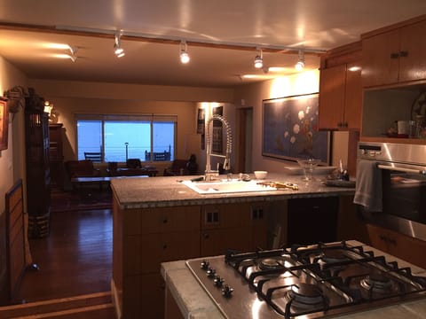 Modern kitchen with gas range, bamboo cabinets -  and all of the fixings!