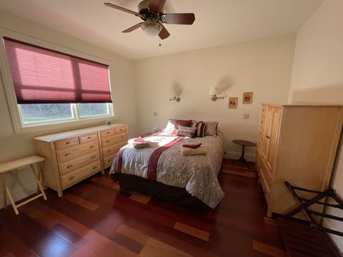 Master bedroom with cherry wood floor