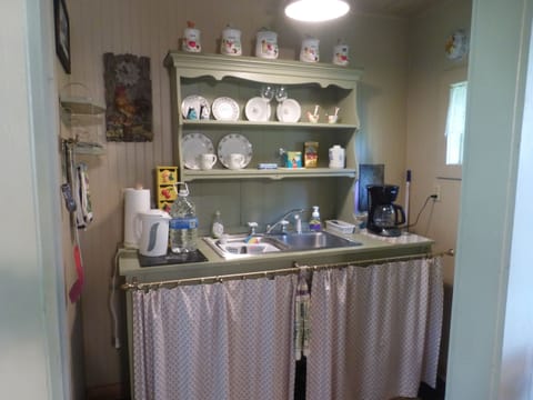 Fridge, coffee/tea maker, electric kettle, cookware/dishes/utensils