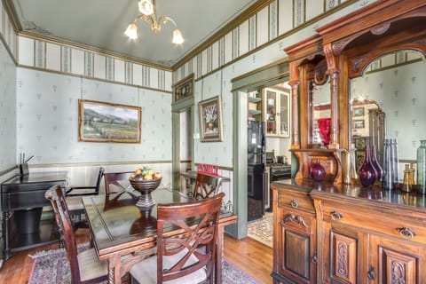 100 year old buffet, ormalou chandelier, desk and chair for work in corner.