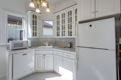 Fully stocked kitchen, microwave, can opener, cutting board, dish washer fridge.