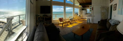 Panoramic view great room, deck and ocean.