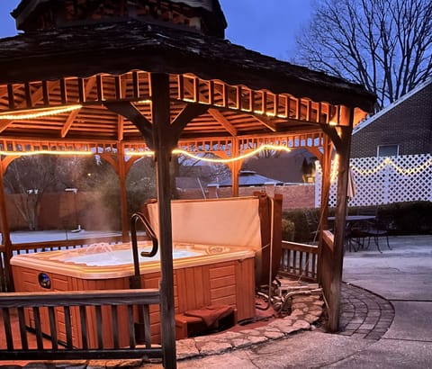 Hot tub and gazebo in the evening. 