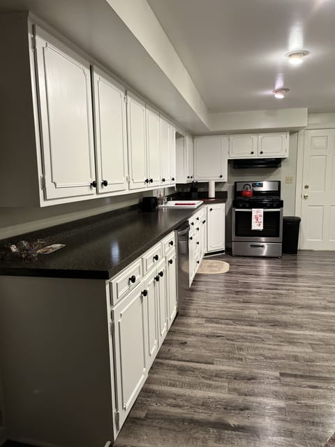 New dishwasher, stove, counter tops, & flooring.