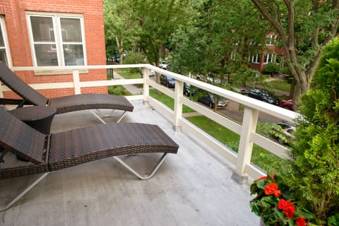 Relax on the spacious balcony overlooking our quiet residential street.
