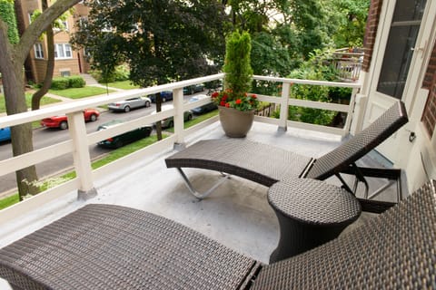 Relax on the spacious balcony overlooking our quiet residential street.