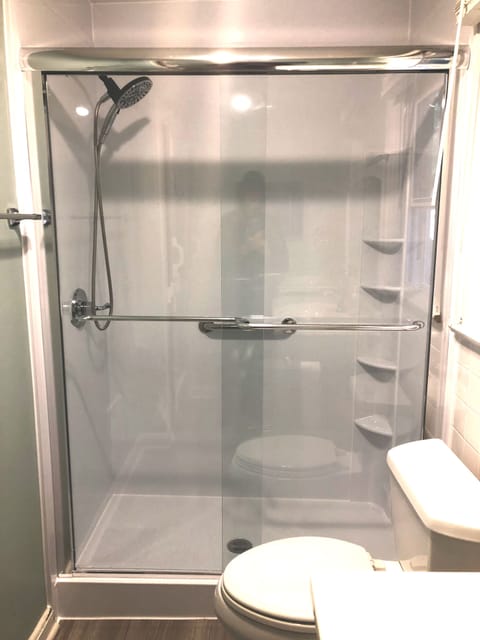 Combined shower/tub, hair dryer, towels, soap