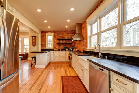 Kitchen including counter bar, soapstone counters, exposed brick