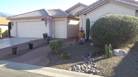 Low maintenance desert landscaping, irrigated by auto timers, walk- way lights.