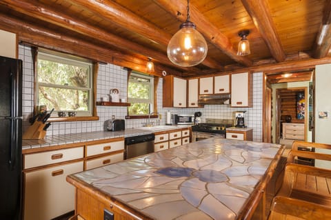 Fully equipped kitchen, charming tile and wood work