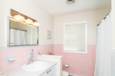 Hallway bathroom  - includes toilet, tub/shower combination