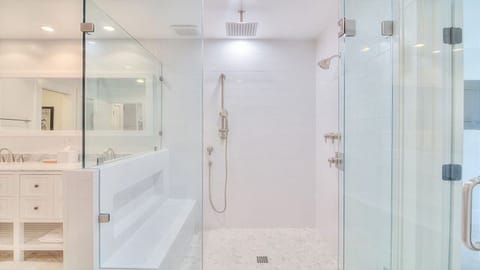 Huge walk-in shower with bench, and 3 showerheads