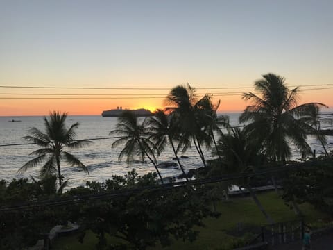 Sunset behind a cruise ship