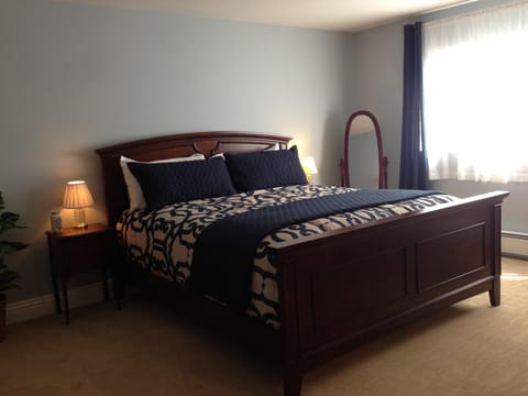 Master bedroom has foam-topped king bed with premium linens.