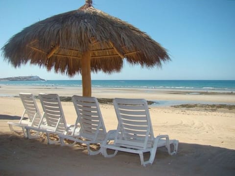 On the beach, sun loungers, beach towels