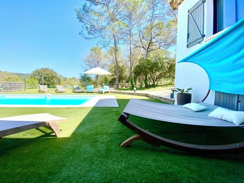 Outdoor pool, a heated pool, sun loungers