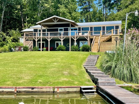 Lakeside view of house/front yard