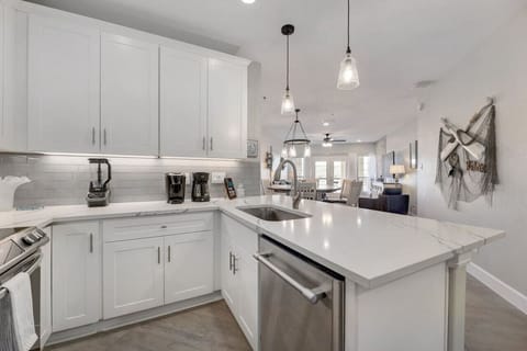 Cook like you mean it—upscale kitchen with a big island and modern finishes, perfect for group meals at Lakeside Serenity.