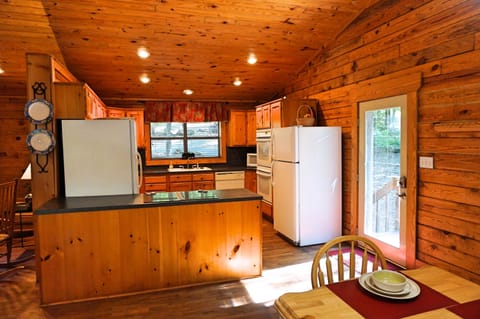 View of side entrance door and kitchen