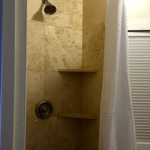 Combined shower/tub, hair dryer, towels, toilet paper