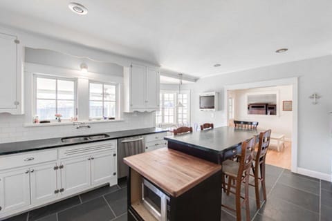 Kitchen bar as second eating area.  Kitchen overlook pool.
