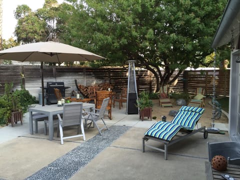 Back yard with all the things needed to enjoy the weather outside 