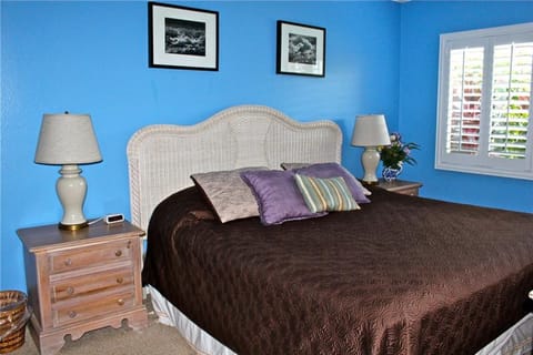 master bedroom with king size bed and private, full bath