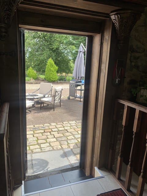 Showing the outside BBQ area, a separate BBQ Hut is situated in the gardens