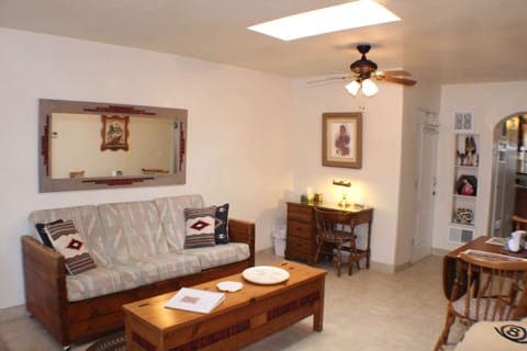 The living/dining area with Taos style couch and small desk perfect for working.