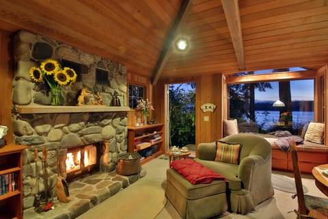 Cozy interior,  wood  fireplace, spectacular water views and picture window seat