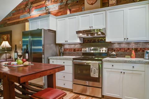 Kitchen with island and seating for two.