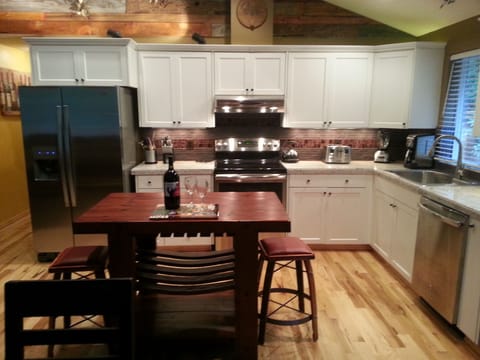 Updated kitchen with wood floors, granite counters & stainless appliances