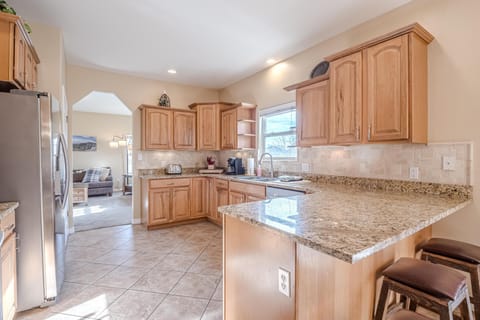 Enjoy the convenience of a well-stocked kitchen, perfect for cooking family meals or enjoying a quick breakfast.