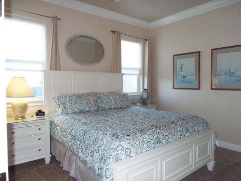 King Bedroom- End Tables- Windows- Sail Boat Art- Flat Screen TV- Dresser Closet