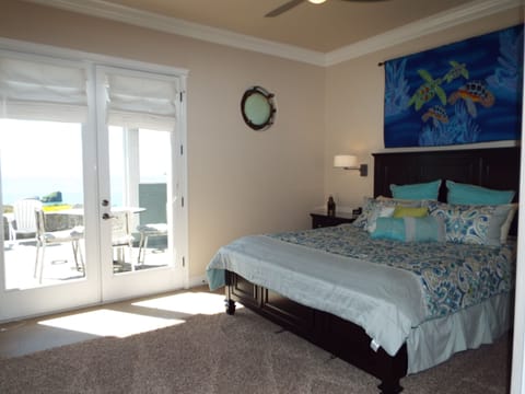 Master bedroom with Ocean Views- Port Hole Window- French Doors opens to Patio!!