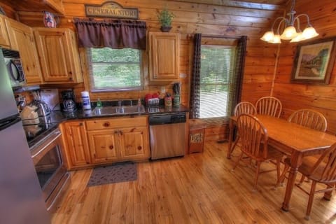 Fully furnished kitchen with dishwasher and microwave.