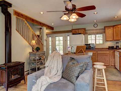 French doors = delightful cross-breeze; propane  designer stove; open kitchen