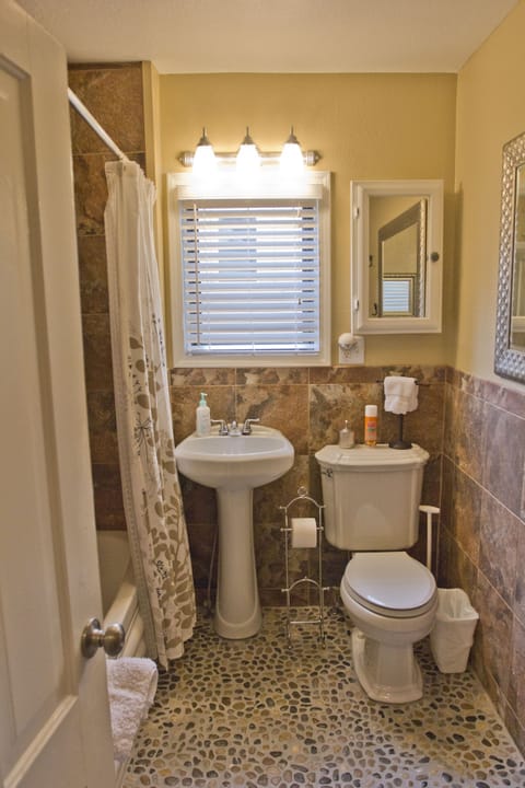 Bathroom with shower/jetted tub combo.