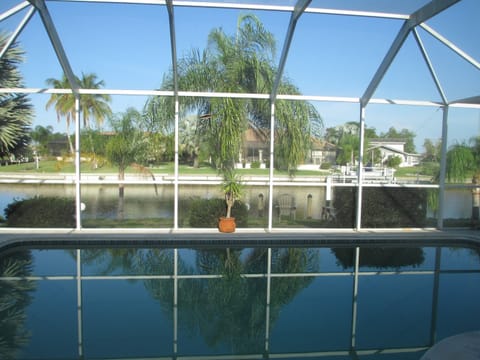 Relax on the lanai by the pool and overlooking the canal.