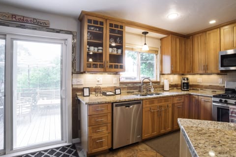 Kitchen access to deck seating areas and hot tub