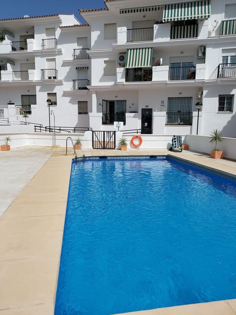 Apt is straight ahead above pool gate 